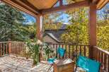 Enjoy the crisp autumn air from this charming covered porch, perfect for savoring your morning coffee or evening tea.
