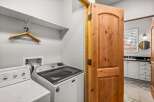 This laundry room features a Maytag washing machine and a dryer, ready for your household needs.