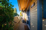 Welcome to this charming home featuring a welcoming entryway with a covered porch and a clear house number '2418'.