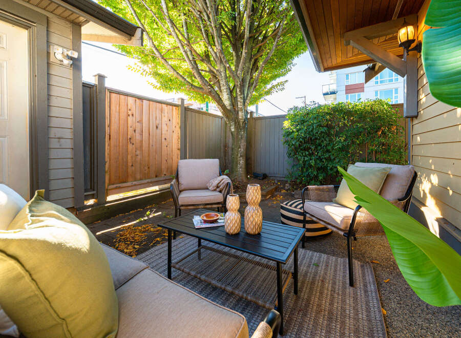 Enjoy outdoor living in this charming patio space, perfect for relaxing or entertaining.