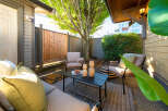 Enjoy outdoor living in this charming patio space, perfect for relaxing or entertaining.