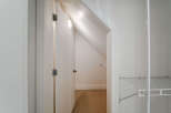 Discover ample storage solutions in this home, featuring a spacious walk-in closet with built-in shelving.