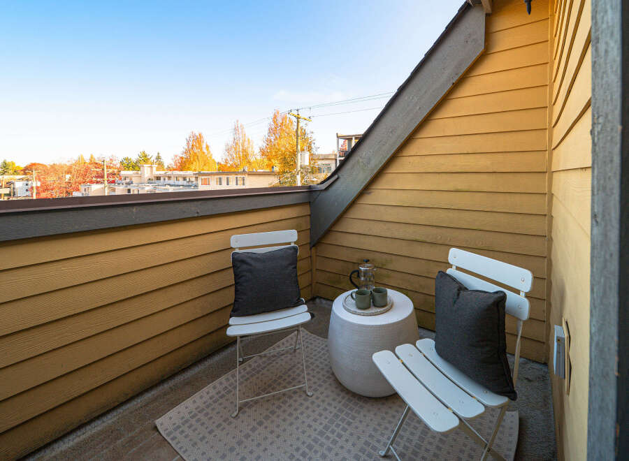 Enjoy your morning coffee or evening tea on this charming balcony, perfect for soaking in the crisp autumn air.
