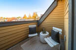 Enjoy your morning coffee or evening tea on this charming balcony, perfect for soaking in the crisp autumn air.