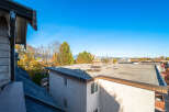Enjoy the stunning panoramic views from this property, showcasing a vibrant cityscape with distant mountains under a clear blue sky.