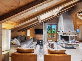 Experience luxurious mountain living in this stunning chalet-style living room.