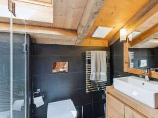 Experience rustic charm and modern convenience in this beautifully appointed bathroom.
