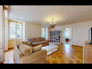 Step into this inviting living room, featuring two plush sofas perfect for relaxation and a modern white coffee table.