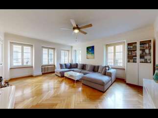 Step into this elegantly appointed living room, featuring a spacious sectional sofa perfect for relaxation and entertaining.