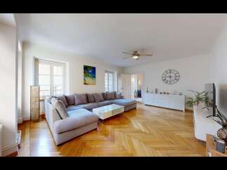 Step into this inviting living room, bathed in natural light from large windows.