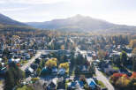 Experience the charm of this picturesque mountain town nestled amidst vibrant autumn foliage.