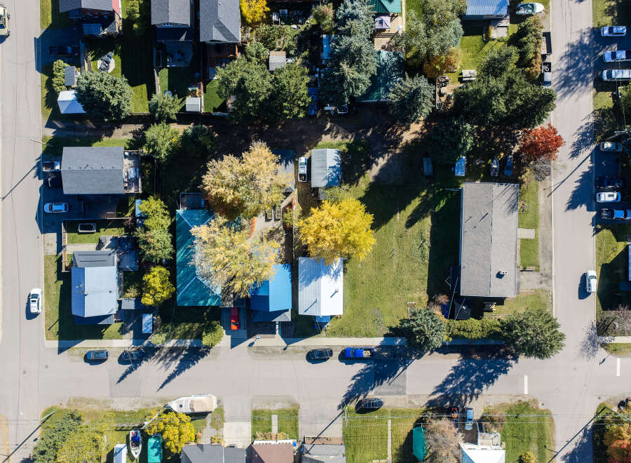 Discover this charming residential neighborhood from an aerial perspective, showcasing a variety of homes with well-maintained yards and mature trees.