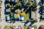 Discover this charming residential neighborhood from an aerial perspective, showcasing a variety of homes with well-maintained yards and mature trees.