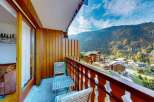 Enjoy breathtaking mountain views from this charming balcony, perfect for your morning coffee or evening relaxation.