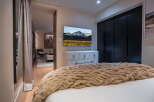 Experience luxury and comfort in this beautifully appointed bedroom.