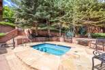 Enjoy a relaxing dip in this inviting hot tub, perfect for unwinding after a day of outdoor adventures.