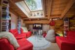 Experience cozy living in this charming attic apartment, featuring exposed wooden beams and a large skylight that floods the space with natural light.