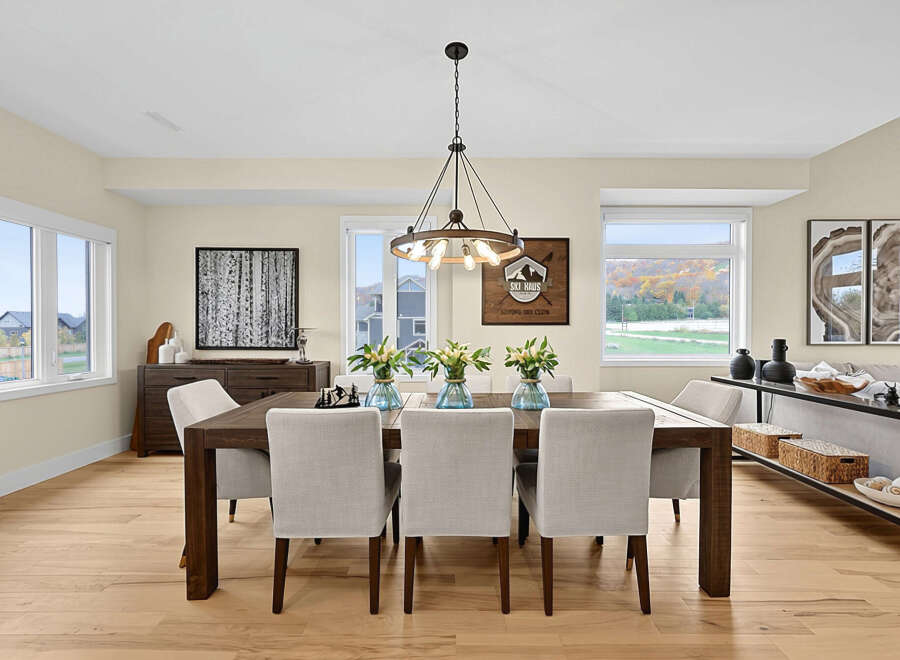 This elegant dining room features a dark wood dining table with upholstered chairs, perfect for hosting family gatherings.