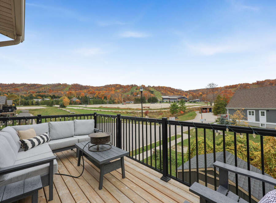 Enjoy breathtaking autumn views from this spacious deck, perfect for entertaining or relaxing.