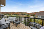 Enjoy breathtaking autumn views from this spacious deck, perfect for entertaining or relaxing.