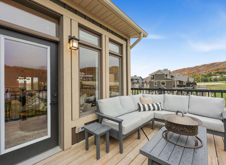 Enjoy breathtaking mountain views from this spacious deck, perfect for entertaining or relaxing.