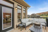 Enjoy breathtaking mountain views from this spacious deck, perfect for entertaining or relaxing.
