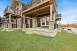 Experience modern living in this stunning townhouse featuring a spacious upper-level deck perfect for entertaining and enjoying the outdoors.