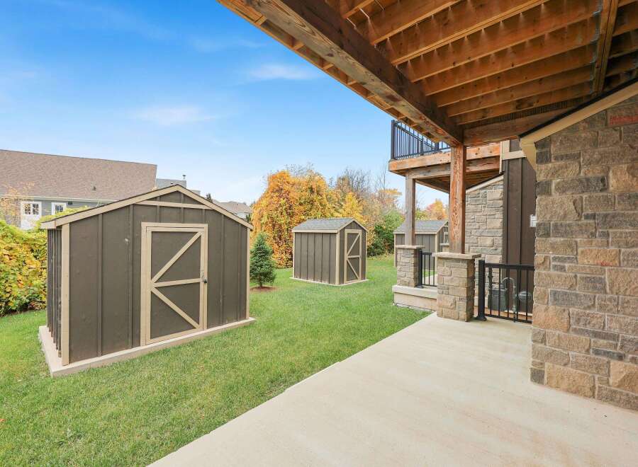 Enjoy the spacious backyard of this property, complete with multiple storage sheds perfect for outdoor equipment and seasonal items.