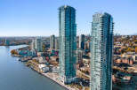 Experience luxury urban living in these stunning waterfront high-rise apartments, featuring breathtaking city and water views.