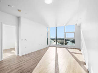 Experience breathtaking panoramic views from this stunning apartment, featuring expansive floor-to-ceiling windows that flood the space with natural light.