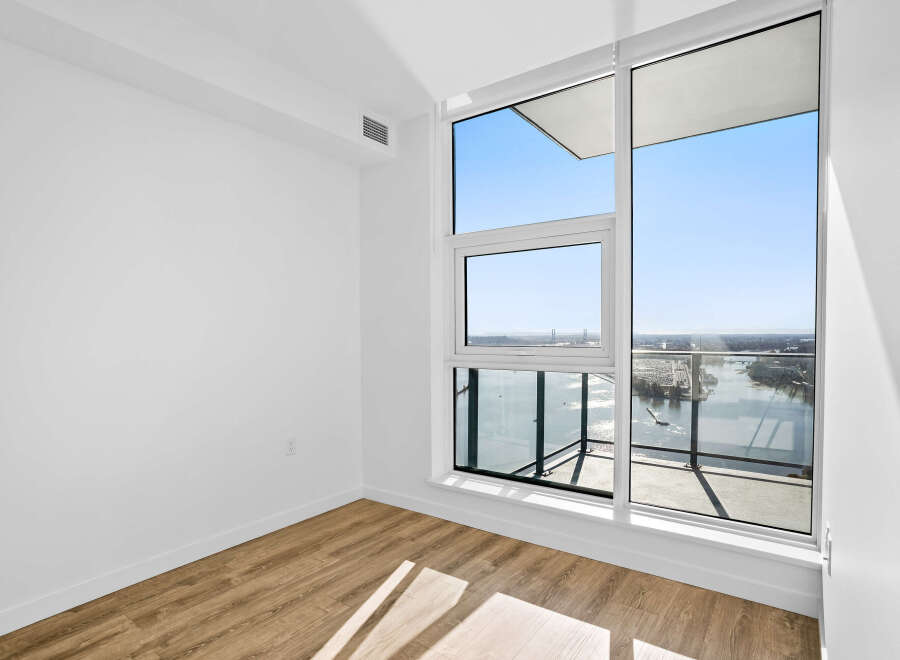 Experience breathtaking views from this modern apartment, featuring expansive windows that flood the space with natural light.