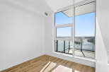 Experience breathtaking views from this modern apartment, featuring expansive windows that flood the space with natural light.