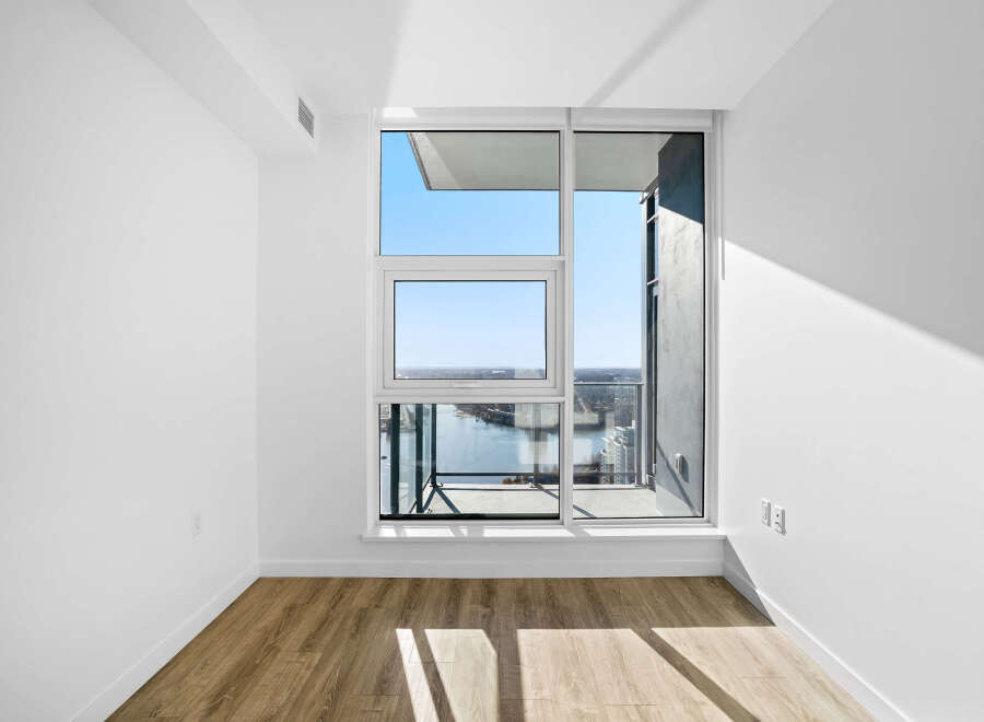 Experience breathtaking panoramic views from this spacious room, featuring expansive windows that flood the space with natural light.