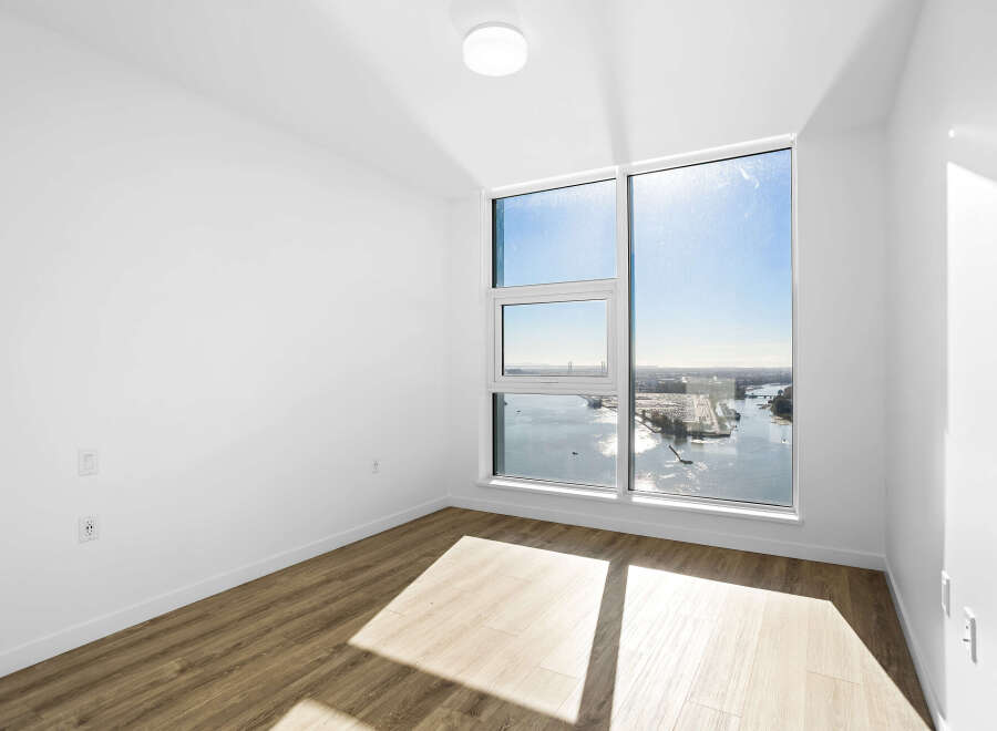 Experience breathtaking panoramic views from this spacious room, featuring expansive windows that flood the space with natural light.