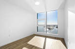 Experience breathtaking panoramic views from this spacious room, featuring expansive windows that flood the space with natural light.