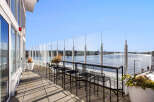 Enjoy breathtaking waterfront views from this expansive balcony, perfect for entertaining or relaxing.