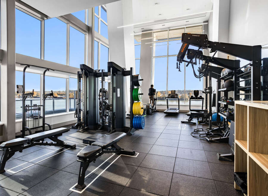 Experience luxury living with this state-of-the-art fitness center, boasting panoramic views of the water and city skyline.