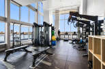 Experience luxury living with this state-of-the-art fitness center, boasting panoramic views of the water and city skyline.