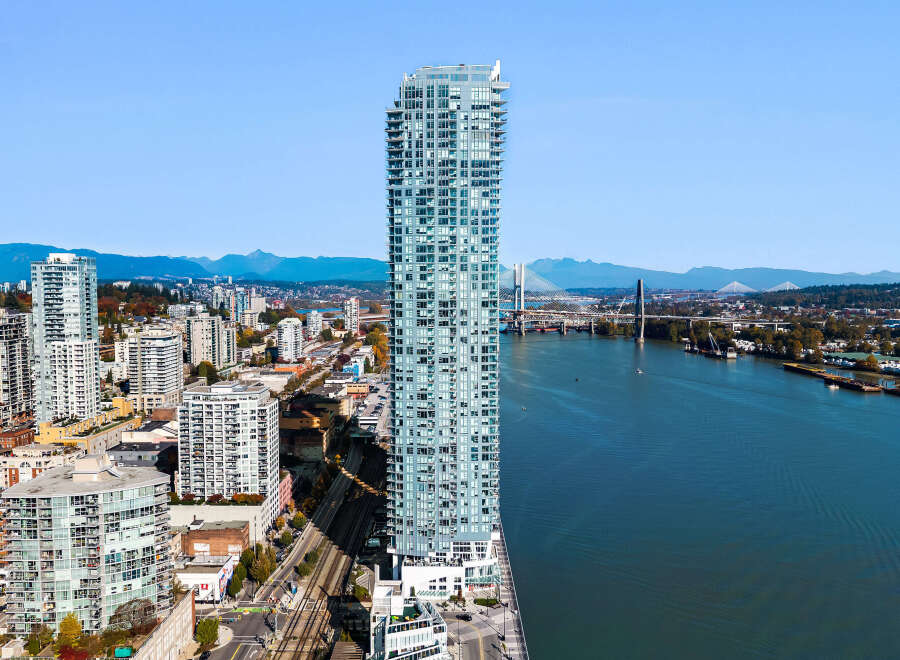 Experience modern urban living in this stunning high-rise apartment complex, boasting breathtaking water and mountain views.