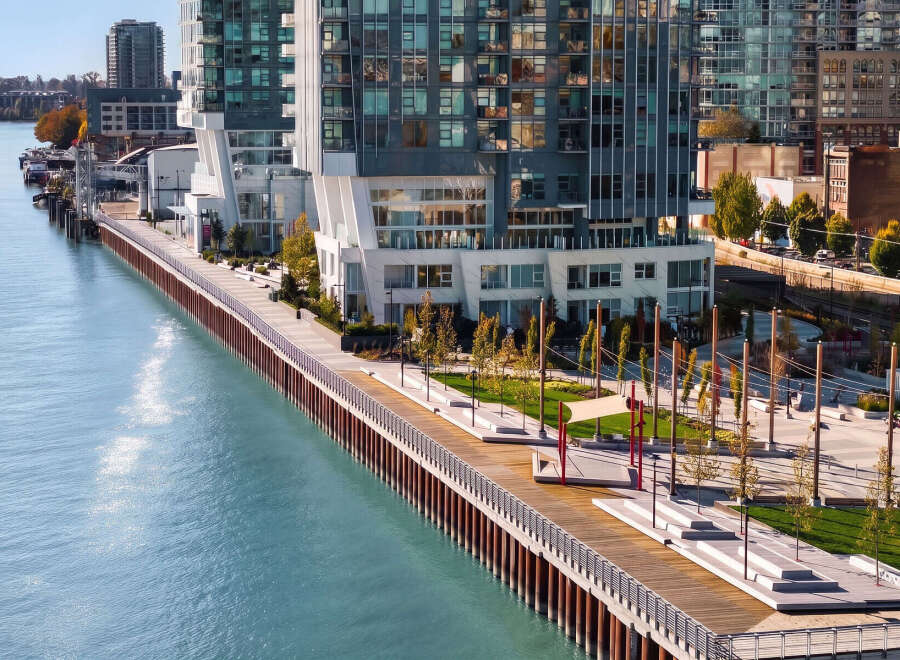 Experience modern waterfront living in this stunning property featuring sleek architecture and expansive glass windows that offer breathtaking water views.