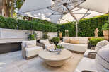 Experience luxurious outdoor living with this beautifully appointed patio space, perfect for entertaining or relaxing.