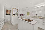 This luxurious bathroom boasts a spacious walk-in shower with a glass enclosure and a modern showerhead.