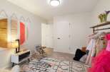 This charming bedroom features a playful and organized space, perfect for a child or creative individual.