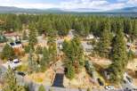 Discover this charming home nestled among mature pine trees, offering a serene and private setting.