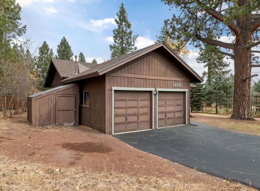 This charming property features a spacious two-car garage with a separate storage shed, perfect for all your needs.