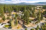 Nestled amidst a dense forest of tall pine trees, this property offers a serene and private retreat.
