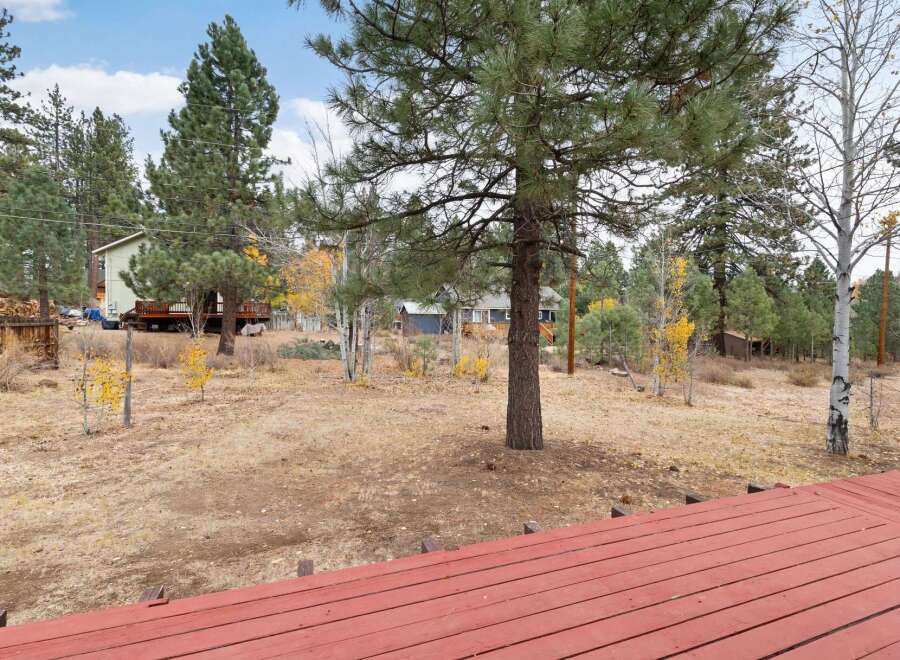 Enjoy the serene mountain lifestyle from this charming property, nestled amongst mature pine and aspen trees.