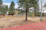 Enjoy the serene mountain lifestyle from this charming property, nestled amongst mature pine and aspen trees.
