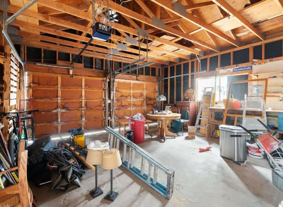 This spacious garage offers ample storage and workspace, perfect for any homeowner.