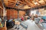 This spacious garage offers ample storage and workspace, perfect for any homeowner.